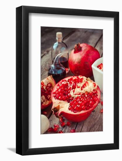 Pomegranate and Bottles of Essence or Tincture on Table-ChamilleWhite-Framed Photographic Print