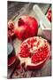 Pomegranate, Juice in Glass, Mortar and Pestle on Wooden Table-ChamilleWhite-Mounted Photographic Print