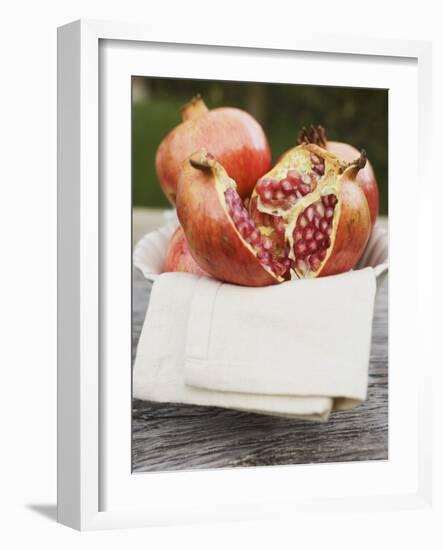 Pomegranates, Whole and Halved, on Cloth in White Bowl-null-Framed Photographic Print