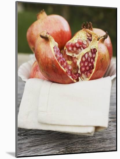 Pomegranates, Whole and Halved, on Cloth in White Bowl-null-Mounted Photographic Print