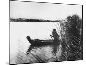 Pomo Indian Poling His Boat Made of Tule Rushes Through Shallows of Clear Lake, Northen California-Edward S^ Curtis-Mounted Photographic Print