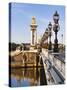 Pont Alexandre-III and Dome des Invalides over Seine river-Rudy Sulgan-Stretched Canvas