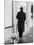 Poodle with Man, Lucerne, Switzerland-Walter Bibikow-Mounted Photographic Print
