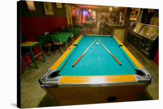 Pool table lit by electric lights in a restaurant and bar in Shoshone, CA near Death Valley Nati...-null-Stretched Canvas