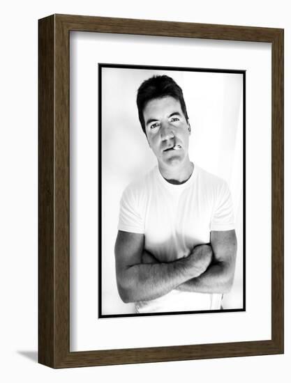 Pop Idol Judge Simon Cowell Poses Smoking a Cigarette at Max Clifford's Office London-null-Framed Photographic Print