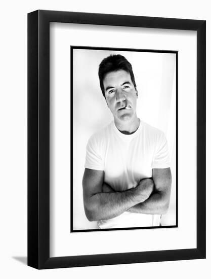 Pop Idol Judge Simon Cowell Poses Smoking a Cigarette at Max Clifford's Office London-null-Framed Photographic Print