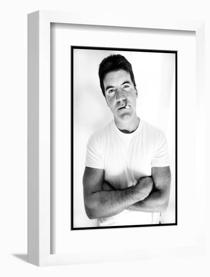 Pop Idol Judge Simon Cowell Poses Smoking a Cigarette at Max Clifford's Office London-null-Framed Photographic Print