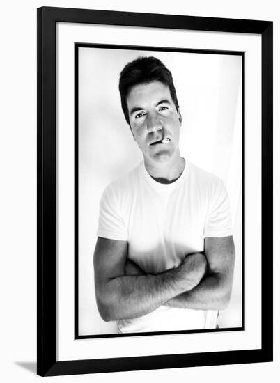 Pop Idol Judge Simon Cowell Poses Smoking a Cigarette at Max Clifford's Office London-null-Framed Photographic Print