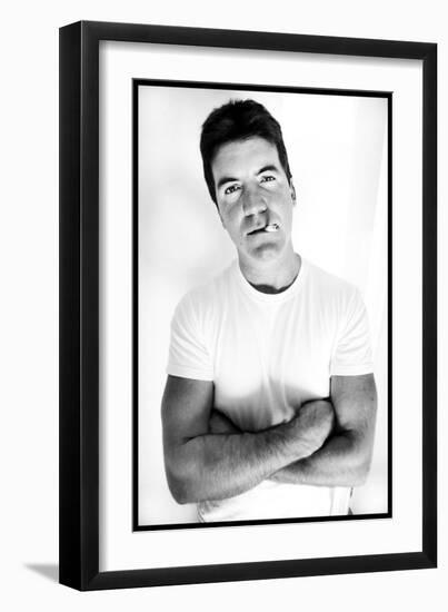 Pop Idol Judge Simon Cowell Poses Smoking a Cigarette at Max Clifford's Office London-null-Framed Photographic Print