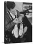 Pop Singer Pat Boone Autographing His White Buck Leather Shoes for Charity-Ralph Morse-Stretched Canvas