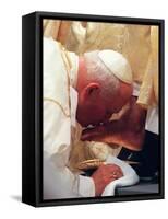 Pope John Paul II Kisses the Foot of a Clergyman-null-Framed Stretched Canvas