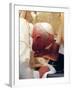 Pope John Paul II Kisses the Foot of a Clergyman-null-Framed Photographic Print