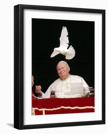 Pope John Paul II Looks at a White Dove After the Angelus Prayer in St. Peter's Square, at Vatican-null-Framed Photographic Print