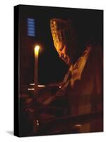Pope John Paul II Prays Before a Candle at the Beginning of an Holy Easter Vigil Mass-null-Stretched Canvas