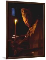 Pope John Paul II Prays Before a Candle at the Beginning of an Holy Easter Vigil Mass-null-Framed Photographic Print