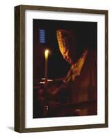 Pope John Paul II Prays Before a Candle at the Beginning of an Holy Easter Vigil Mass-null-Framed Photographic Print