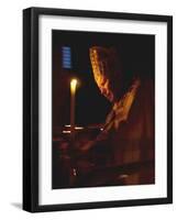 Pope John Paul II Prays Before a Candle at the Beginning of an Holy Easter Vigil Mass-null-Framed Photographic Print