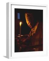 Pope John Paul II Prays Before a Candle at the Beginning of an Holy Easter Vigil Mass-null-Framed Photographic Print