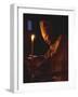 Pope John Paul II Prays Before a Candle at the Beginning of an Holy Easter Vigil Mass-null-Framed Photographic Print