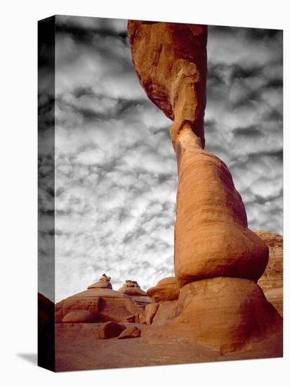 Portion of Delicate Arch Against Clouds, Arches National Park, Utah, USA-Jim Zuckerman-Stretched Canvas