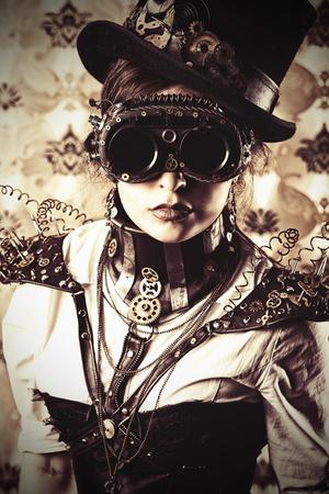 https://imgc.allpostersimages.com/img/posters/portrait-of-a-beautiful-steampunk-woman-over-vintage-background_u-L-PN0N0I0.jpg?artPerspective=n