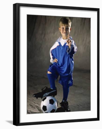 Portrait of a Boy Standing with His Foot on a Soccer Ball-null-Framed Photographic Print