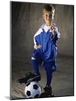 Portrait of a Boy Standing with His Foot on a Soccer Ball-null-Mounted Photographic Print