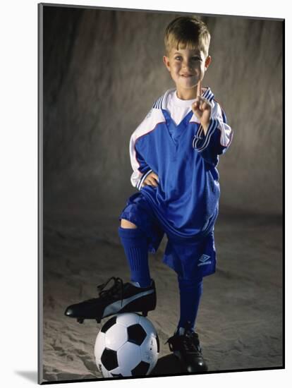 Portrait of a Boy Standing with His Foot on a Soccer Ball-null-Mounted Photographic Print