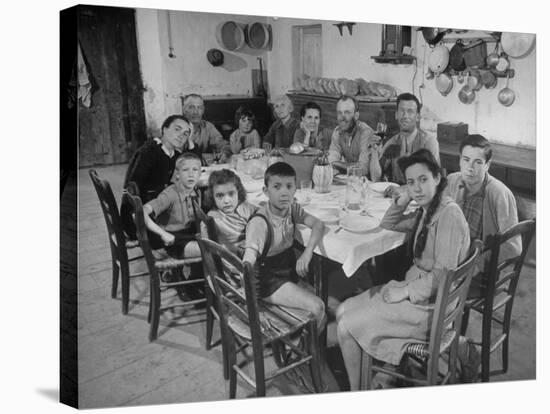 Portrait of a Family of Tuscan Tennat Farmers Sitting around Dinner Table-Alfred Eisenstaedt-Stretched Canvas