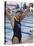 Portrait of a Joyous Girl Standing Beside a Swimming Pool-null-Stretched Canvas