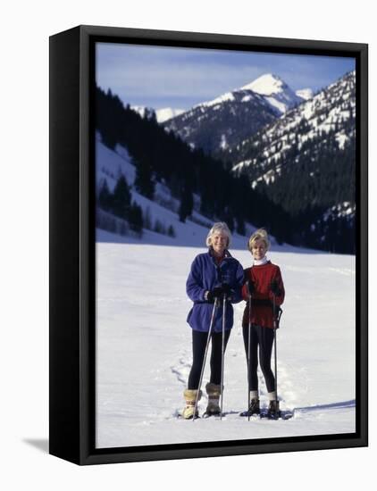 Portrait of a Senior Woman and a Young Woman Standing Wearing Skis-null-Framed Stretched Canvas