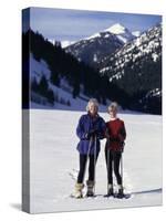 Portrait of a Senior Woman and a Young Woman Standing Wearing Skis-null-Stretched Canvas