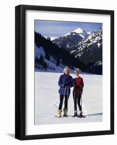 Portrait of a Senior Woman and a Young Woman Standing Wearing Skis-null-Framed Photographic Print