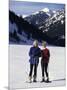 Portrait of a Senior Woman and a Young Woman Standing Wearing Skis-null-Mounted Photographic Print