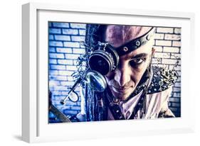 Portrait Of A Steampunk Man With A Mechanical Devices Over Brick Wall-prometeus-Framed Art Print