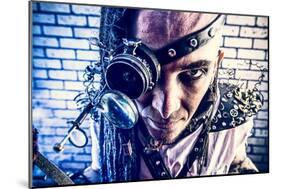Portrait Of A Steampunk Man With A Mechanical Devices Over Brick Wall-prometeus-Mounted Art Print