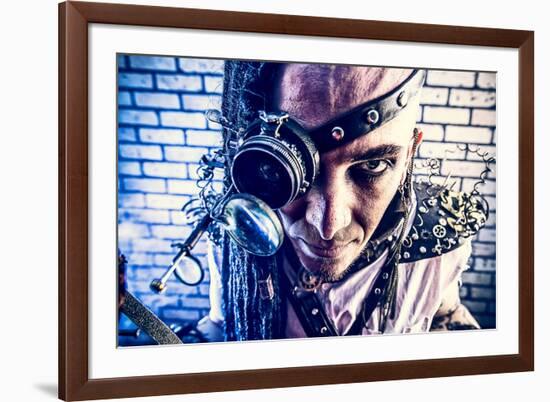 Portrait Of A Steampunk Man With A Mechanical Devices Over Brick Wall-prometeus-Framed Art Print