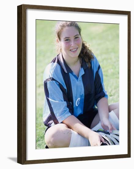 Portrait of a Teenage Girl Sitting on a Lawn Smiling-null-Framed Photographic Print