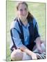 Portrait of a Teenage Girl Sitting on a Lawn Smiling-null-Mounted Photographic Print