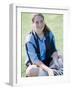 Portrait of a Teenage Girl Sitting on a Lawn Smiling-null-Framed Photographic Print