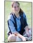 Portrait of a Teenage Girl Sitting on a Lawn Smiling-null-Mounted Photographic Print