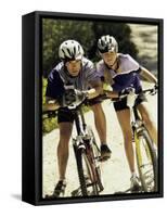 Portrait of a Young Couple Sitting on Bicycles-null-Framed Stretched Canvas