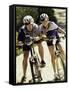 Portrait of a Young Couple Sitting on Bicycles-null-Framed Stretched Canvas