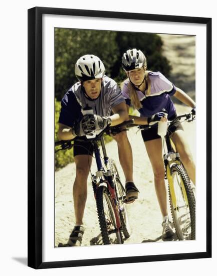 Portrait of a Young Couple Sitting on Bicycles-null-Framed Premium Photographic Print