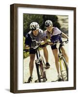 Portrait of a Young Couple Sitting on Bicycles-null-Framed Photographic Print