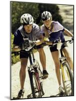 Portrait of a Young Couple Sitting on Bicycles-null-Mounted Photographic Print