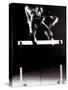 Portrait of a Young Man Jumping over a Hurdle-null-Stretched Canvas