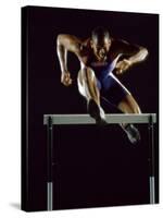 Portrait of a Young Man Jumping over a Hurdle-null-Stretched Canvas