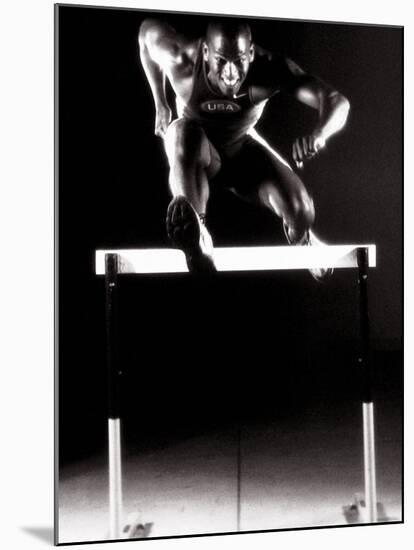 Portrait of a Young Man Jumping over a Hurdle-null-Mounted Photographic Print