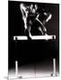 Portrait of a Young Man Jumping over a Hurdle-null-Mounted Photographic Print